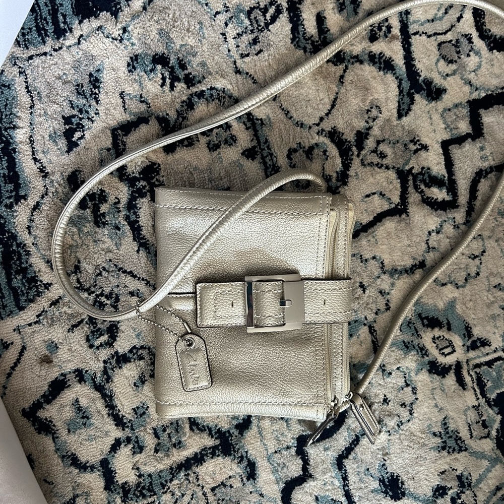 Multi pocket gold cross body bag leather